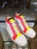 CHRISTIAN LOUBOUTIN Spiked Louis Trainers white pink and yellow 